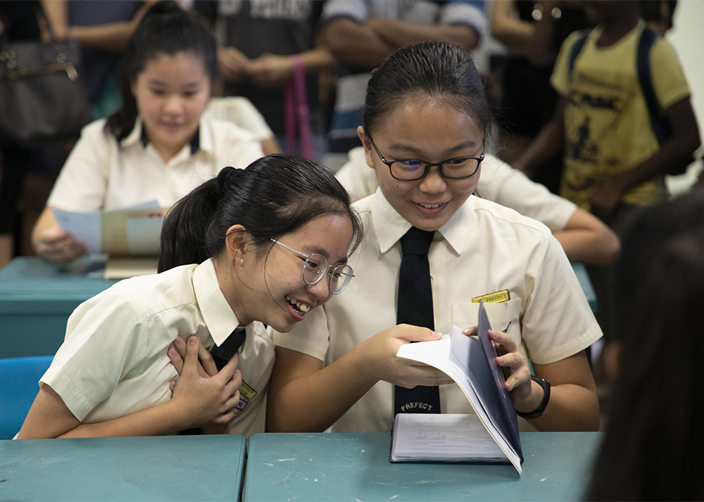 Stock image: Students receiving their PSLE results.