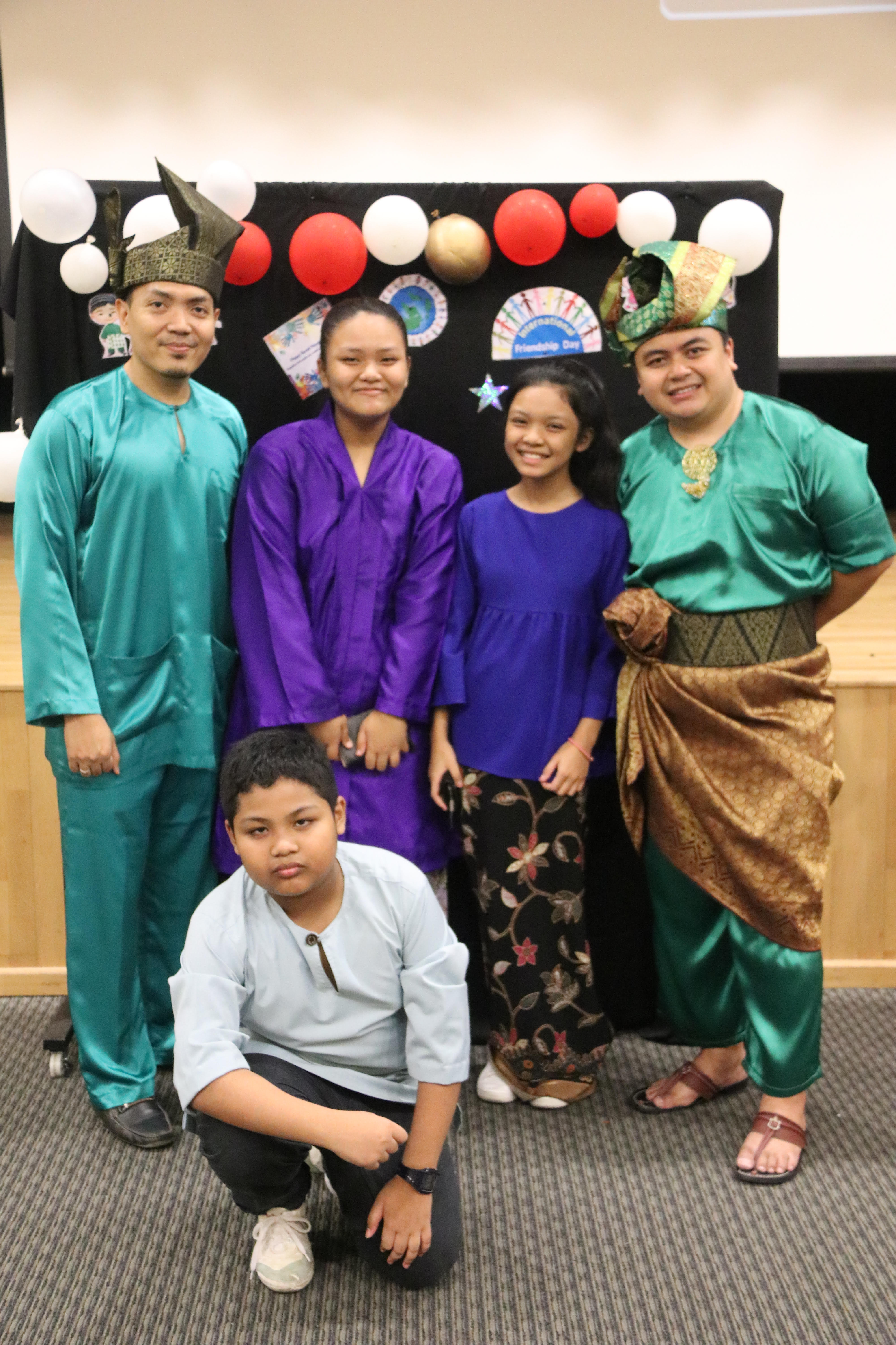 Mr Amirul (far right) helps his students gain confidence on stage. (Photo taken before Covid-19.)