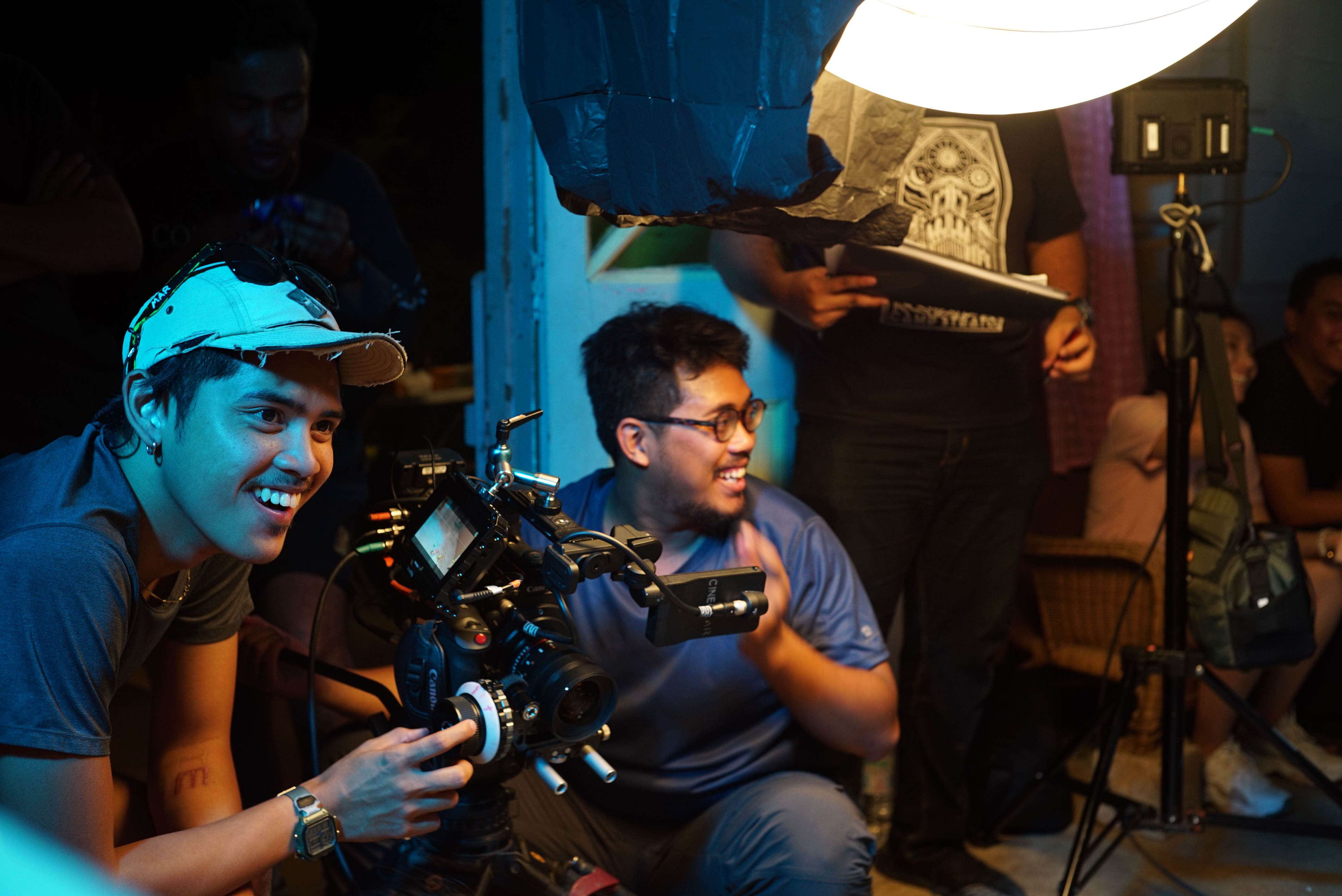 Ammar (front) working as a Camera Assistant on the set of ‘Saka’, one of the Top 15 horror short films in Asia Scream Festival 2019. Photo credit: Infidow Pictures