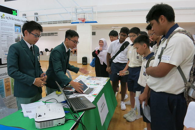 Student ambassadors, Gerald Lai and Ong Tao Jie from Ang Mo Kio Secondary School showcasing their cyber wellness initiatives.