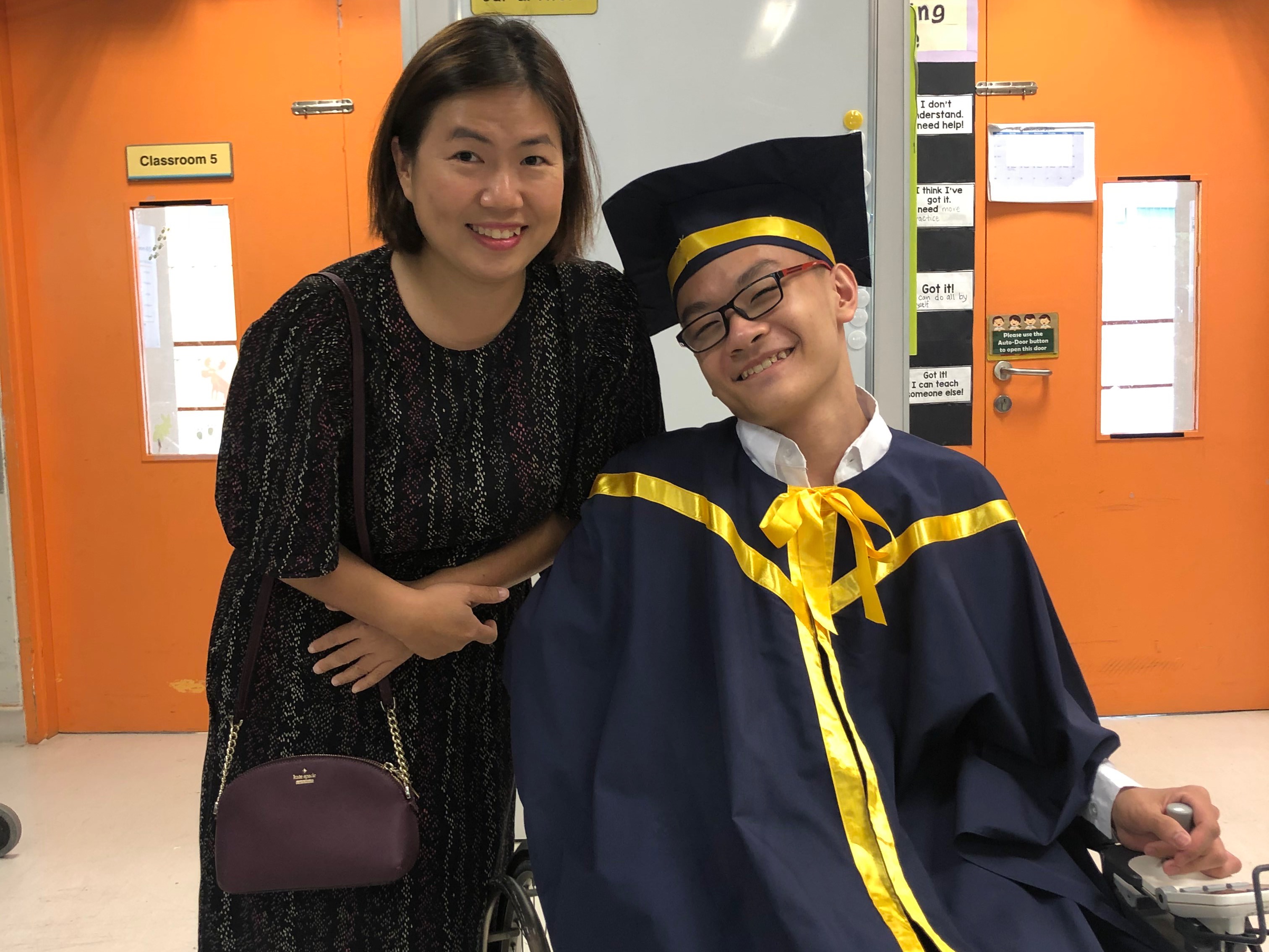 Ms Michelle Chin Mei Foong and Jerryl Ong Zi Wei at the Cerebral Palsy Alliance Singapore School’s Year End Graduation Ceremony cum Prom. (Photo taken before COVID-19.)
