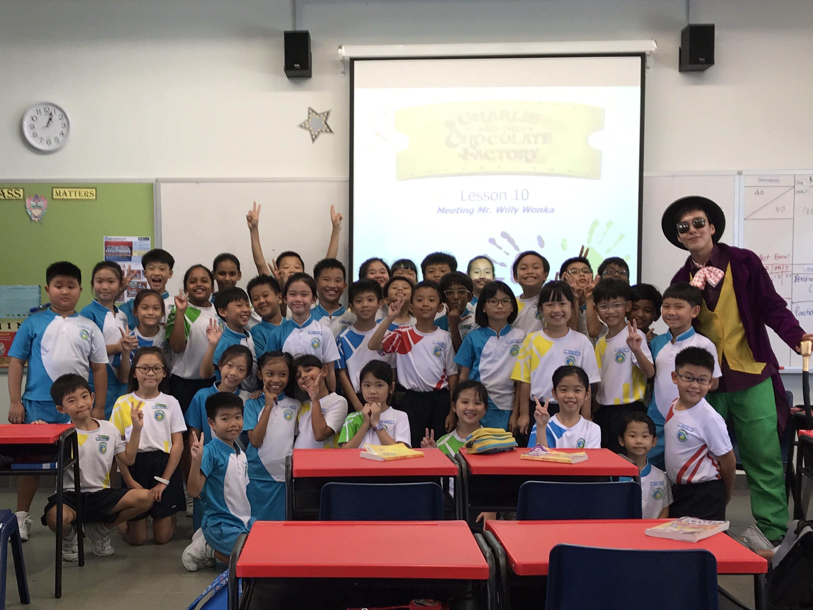 Mr Desmond Lim dresses up as Mr Willy Wonka, a character from the book Charlie and the Chocolate Factory, as part of a hot-seating activity. (Photo taken before COVID-19.)
