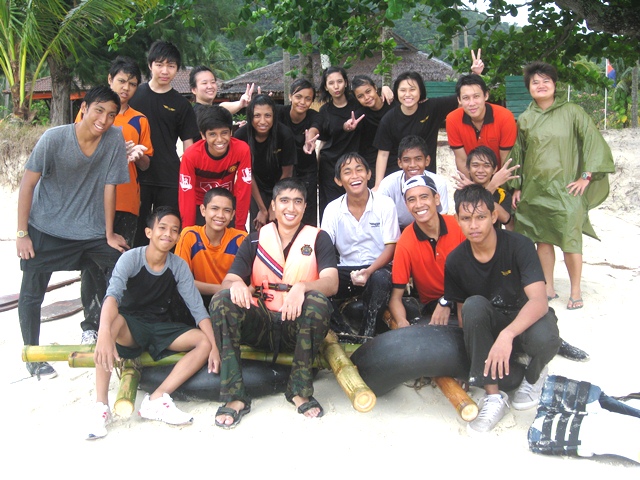 Hazelman with his Secondary 3 Normal (Technical) form class students at an overseas camp in Pulau Besar, in 2011. They had just finished a raft-building activity. Photo Credit: Changkat Changi Secondary School 
