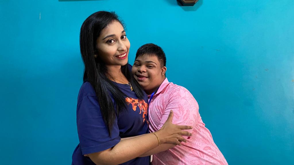 Yugi shares a hug with his older sister Nithiya. Yugi loves to show his affection through his bright smiles and warm hugs!