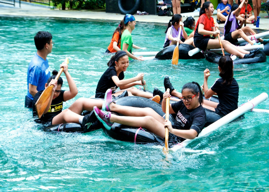 Splish and splash! Marymount Convent School students testing out their raft which was designed and constructed by themselves during their adventure camp. (Photo: Marymount Convent School)