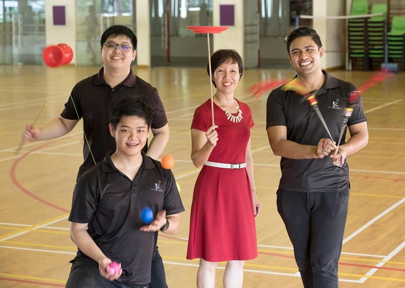 (L-R) Edward Chua, Benjamin Teo and Firdaus Ahmed with their former Vice-Principal, Ms Chew Ing Lim.