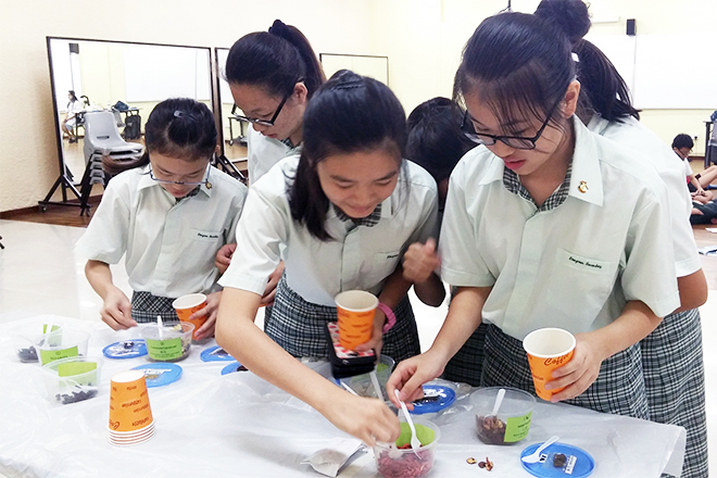 Students handling TCM herbs