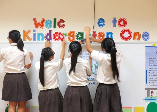 Volunteering their time during the holidays, students of Dunman Secondary School helped to decorate classrooms at the MOE Kindergarten @ Tampines.