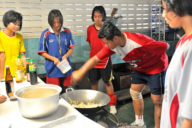 Thai coach prepares meals for his students