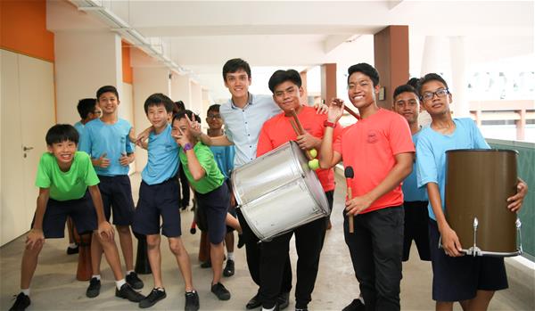 Mr Cai Zhiwen and his students from the drumming group, which was set up to give students a greater sense of belonging to the school. 