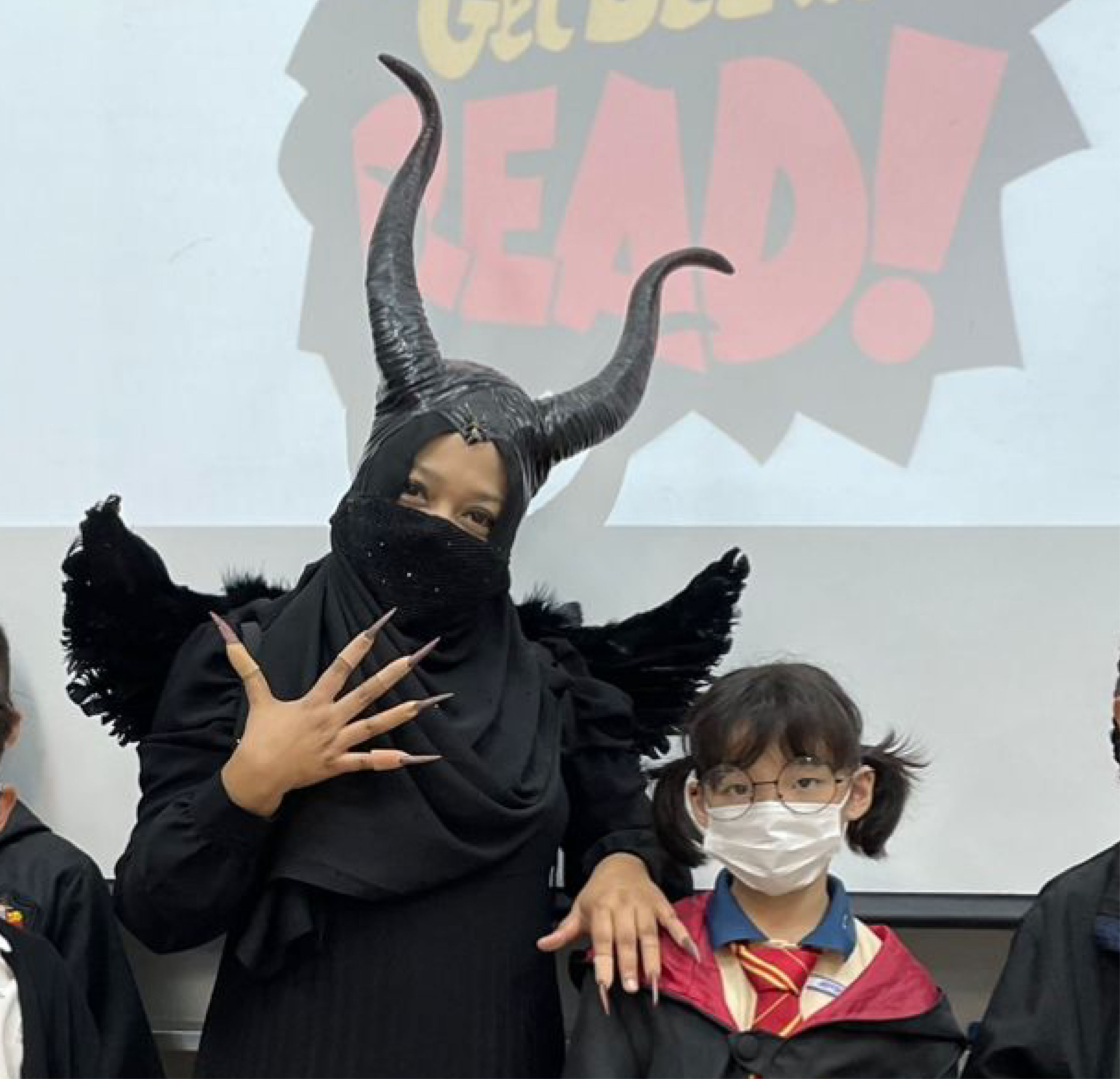 The writer’s daughter dressed up as Harry Potter, with her English teacher Mdm Noor Rita dressed as Maleficent, for Reading Week at school. Photo: Mdm Noor Rita
