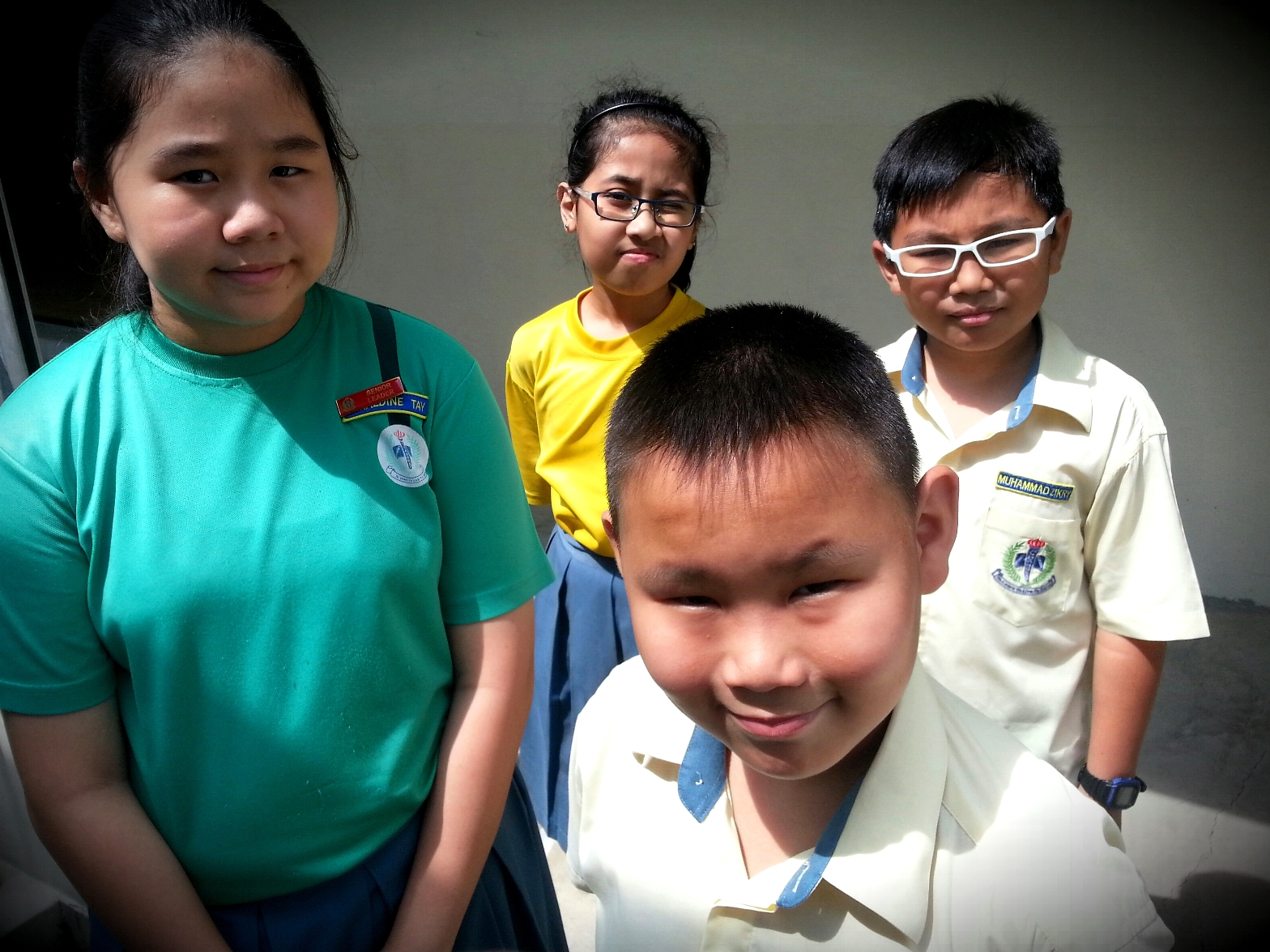 Sam (second from right) was able to cope with dyslexia better in primary school, with the help of an Allied Educator. (Photo credit: Changkat Primary School)  
