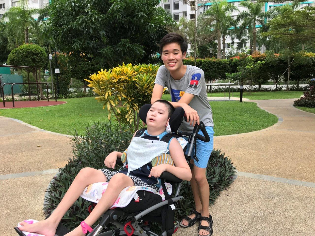 Yao Kang and Yao An enjoy taking walks in the park. Yao An looks forward to these opportunities to venture outside of his home. (Photo was taken before Covid-19.)  
