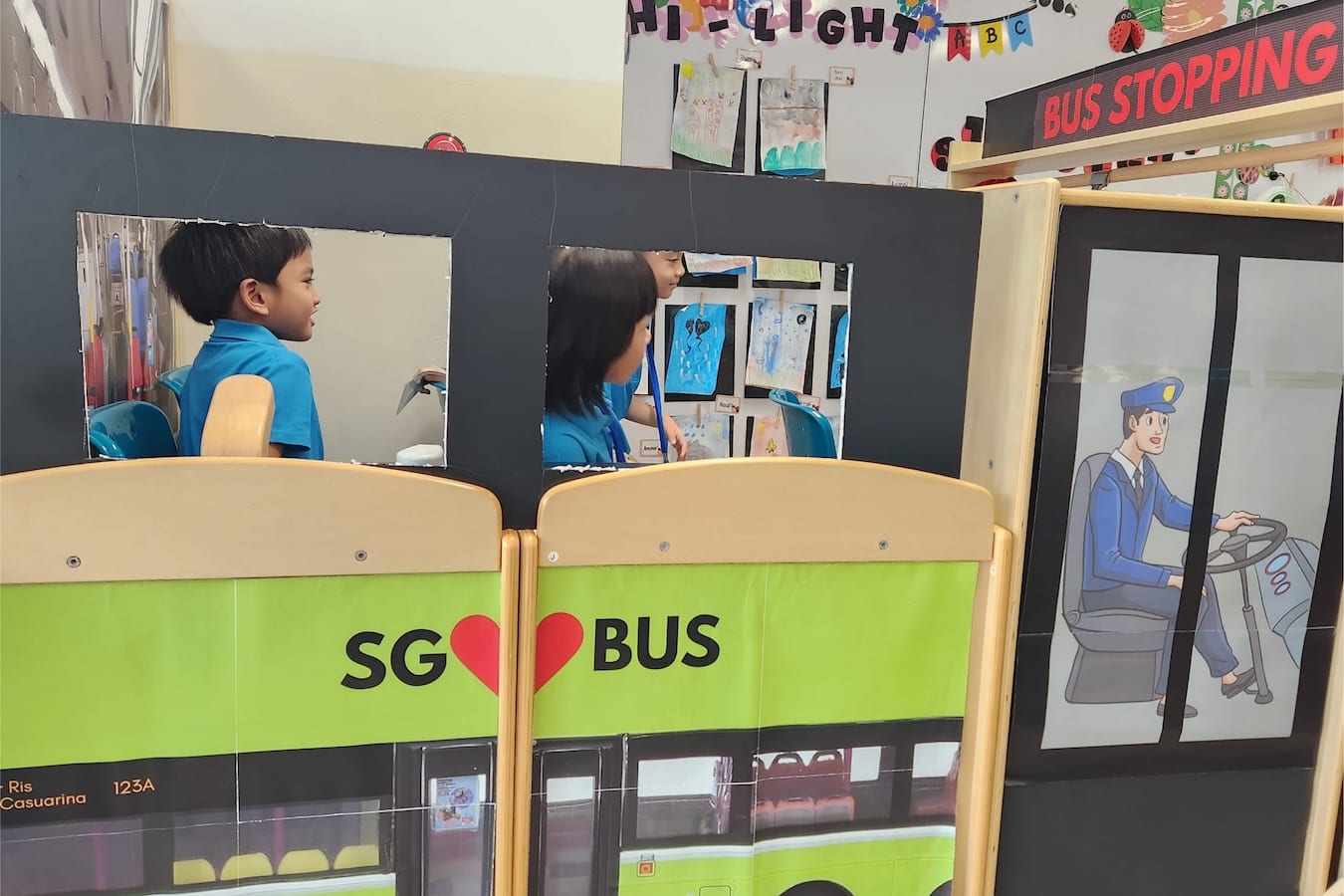 side profile of children in an imaginary bus during play