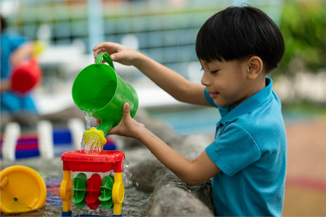 a child using a watering can